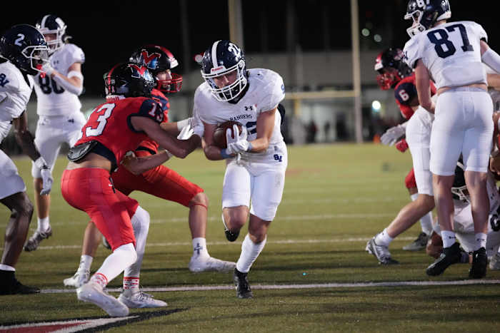 Smithson Valley junior running back Daniel DeHoyos takes a handoff during the first half of the UIL 5A Division I state semifinal at Buc Stadium in Corpus Christi on Friday night.